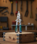 2 Pack Foldable Wire Strippers With Built In Voltage Tester, 13 In 1 Multi Purpose Electrician Pliers on wooden box.