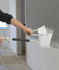 Built Tough Air Stucco Texture Hopper Sprayer Cranks Out Fast Wall Coating With Four Swappable Nozzles For Quick Mortar Spread And Flawless House Paint Finish in use on wall.