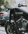 Close-up of a motorcycle gas tank with breather vent hose installed, compatible with Six Pack Aluminum Universal Motorcycle Breather Vent Hose Kit For Gas Tank Cap And Fuel Tank Vent Tube Fits All Off Road Motorcycles ATVs Pit Bikes And Dirt Bikes Vibration Resistant Corrosion Proof.