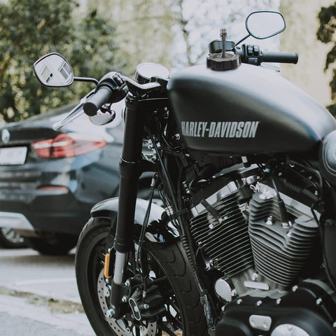 Close-up of a motorcycle gas tank with breather vent hose installed, compatible with Six Pack Aluminum Universal Motorcycle Breather Vent Hose Kit For Gas Tank Cap And Fuel Tank Vent Tube Fits All Off Road Motorcycles ATVs Pit Bikes And Dirt Bikes Vibration Resistant Corrosion Proof.