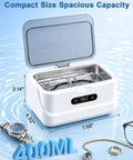 Top Shelf Professional 48KHz Ultrasonic Jewelry Cleaner Heavy Duty 400ml tank with eyeglasses and jewelry inside.