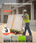 Worker using Drywall Cart Dolly With 1800 Lb Load Capacity And Expandable Deck on construction site, showing tie-down straps and swivel casters