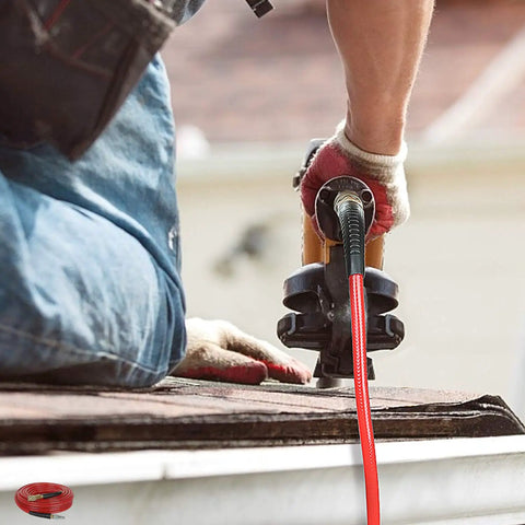 Quarter Inch 100 Ft Polyurethane Air Hose With Bend Restrictors, Flexible Workhorse For Indoor Finishing Projects, Includes One Quarter Inch Industrial Quick Coupler And Plug Kit, Red being used with a power tool on a roof