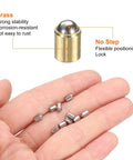 30 Pack Of Snappy Mini Brass Ball Spring Plungers 6X7mm Heavy Duty Detent Catch Latches For Cabinet Doors And Garage Builds Smooth Operator Action And Rock Solid Workhorse Quality. Hand holding brass ball and mini plungers.