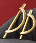 Brushed Gold Half Moon Cabinet Pulls 3.75 Inch Dope Antique Kitchen Drawer Handles shown on grey fabric