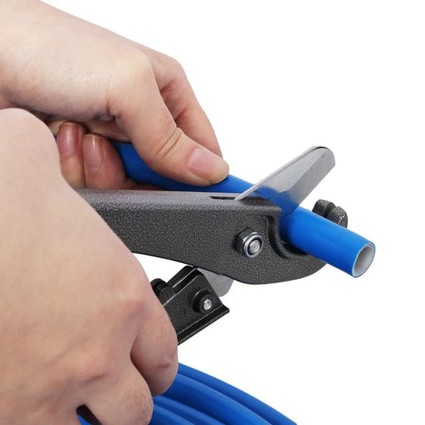 Hand cutting blue tubing with heavy duty tools for Heavy Duty Air Compressor Piping Kit Featuring Two Hundred Foot One Half Inch Rugged Tubing Slick Pex Al Pex Build Pro Fittings Valves And Zero Sweat Plug Play Tools For Quick Garage Setup Blue.