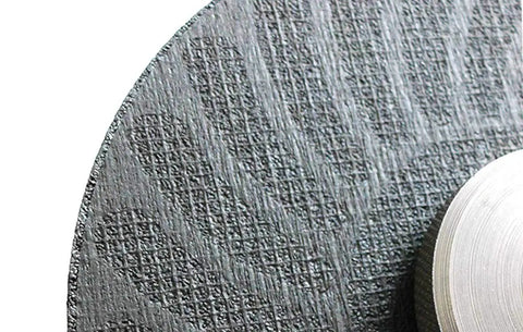 Close-up of textured surface of a Cut Off Wheel Pack of 25 for Angle Grinders, Beefy Performance Abrasive Wheel for metal cutting.
