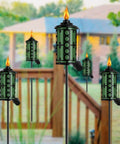 Outdoor Metal Torch Set Six Pack 59 Inch Citronella Garden Torches with 3 Prong Grounded Stake installed on patio