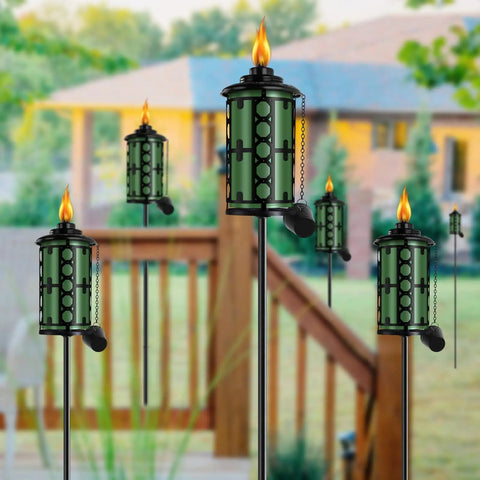 Outdoor Metal Torch Set Six Pack 59 Inch Citronella Garden Torches with 3 Prong Grounded Stake installed on patio
