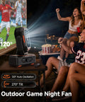 Portable Camping Fan With 20000mAh Battery Remote And Led Lantern used outdoors during a game night with friends, showing tilt and oscillation angles.