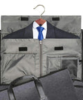Convertible garment duffel bag open with suit on hanger for travel.