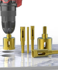 Heavy Duty Three Piece Diamond Drill Bit Hole Saw Kit For Smashing Through Ceramic Tile Granite Marble And Glass Bottles Without Breakage Plus Knockout Cutting Power Measures Two Fifth To Four Fifth Inches Wide on a marble surface