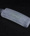 Hiking Hydration Bottle With Protective Dust Cover Leakproof And Lightweight Water Holder on a wet surface