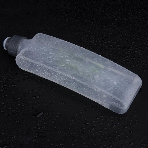 Hiking Hydration Bottle With Protective Dust Cover Leakproof And Lightweight Water Holder on a wet surface