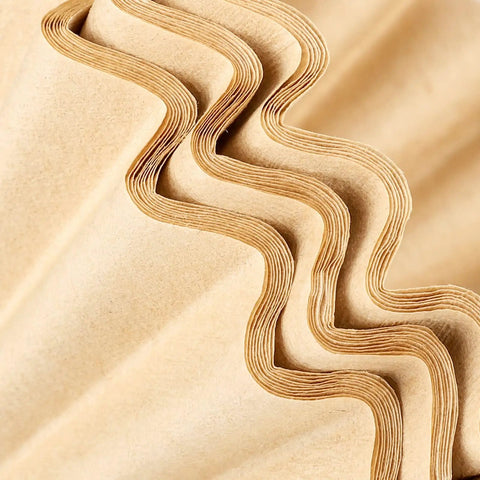 Close-up of eco-friendly Unbleached 1-2 Cup Coffee Filters Pack Of 50 For Small Basket Style Pour Over and Drip Coffee Makers
