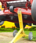 Image of Heavy Duty Mower Jack Lift for Commercial and Residential Mowers Up To 800 Pounds, lifting a red mower outdoors.