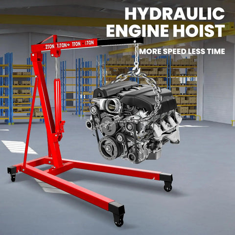 Heavy Duty 2 Ton Folding Hydraulic Engine Hoist with engine suspended in garage, showcasing sturdy design for 4000 pounds capacity.