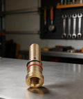 Copper Gas Diffuser Nozzles For MIG Welding Guns 4335 Style on workbench in industrial setting