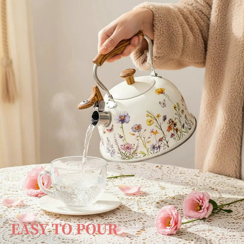 Stovetop Whistling Tea Kettle Two Point Seven Quart Floral Pattern Stainless Steel Tea Pot With Wood Pattern Handle Perfect For Boiling Water Coffee Or Milk Durable All Stovetop Kitchen Must Have For Real Essential pouring water into cup