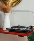 Audio-Technica belt-drive turntable setup on shelf, featuring fully automatic playback with J shaped tonearm for high fidelity sound.