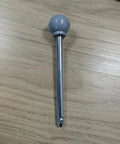 Spring Latch Pin For Stair Machines And Gym Equipment Replacement Part With Smooth Insert Tip And Easy Release Locking Adjustment Pin For Home Workouts And Equipment Repair Gray metal pin on wood