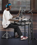 Person playing Dope Electric Drum Set With 32 Kits And 480 Sounds USB MIDI Compatible Electronic Drum Kit Quiet 8 Inch Mesh Snare 10 Inch Cymbals