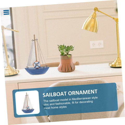 Mediterranean Wooden Sailboat Model Decor for Home and Office Cozy Cottage Nautical Vibe Ornament on a desk with lamp and plant