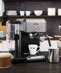 Your New Favorite Hustle Free Automatic Espresso And Cappuccino Maker Featuring Boss Level 15 Bar Pressure And Thermal Heating For Truly On Point Lattes In Silver And Black on kitchen countertop.