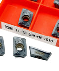 Heavy Duty Indexable Carbide Lathe Tool For External Turning R390 11T308 Cutting Blade in orange case, showing sharp edges.