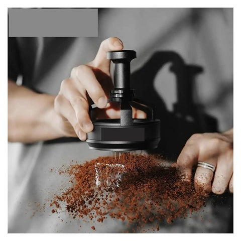 Level Up Your Home Barista Setup With This Dope 58Mm Espresso WDT Tool Featuring Six Heat Resistant Needles Adjustable Depth Control And Hidden Magnetic Storage For Zero Fuss Morning Routines, black WDT tool in use over coffee grounds.