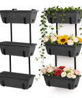 Get Your Garden Game On Point With This Set Of Two Deck Railing Planter Boxes That Clip Over Fence Rails Packed With Six Tough Plastic Flower Pots To Make Growing Herbs Veggies Or Blooms An Absolute Breeze For Chill Weekends And Easy Peasy Garden Vibes. Vertical arrangement of dark gray planter boxes holding colorful flowers and greenery.