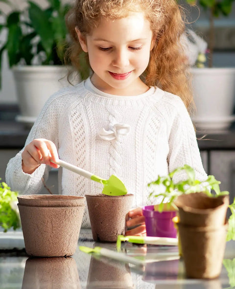 Child using Seed Starter Pots Set With 60 Pcs In 3.15 And 4 Inch Sizes, Drainage Holes For Easy Transplanting, Compostable Nursery Pots, Plus 20 Bonus Plant Labels