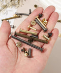 Top Tier Brass Chicago Screw Rivets M4x25mm Phillips Head Studs For DIY Leather Belts Bags Wallets 10 Pack Set in hand.
