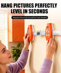 Professional 3 In 1 Picture Hanging Tool And Spirit Level Features Precision Measuring Ruler With Magnetic Nail Starter For No Sweat Wall Art Installation Diy Home Decor Game Changer in use on wall.
