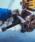 Beefed-Up Heavy Duty Yoke Puller Kit For Class 6-8 Trucks And Equipment in use, extracting yokes from a large truck driveline.