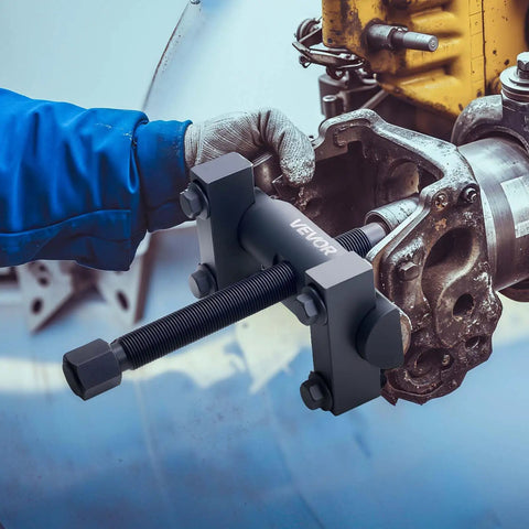 Beefed-Up Heavy Duty Yoke Puller Kit For Class 6-8 Trucks And Equipment in use, extracting yokes from a large truck driveline.