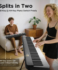 Two people playing 88 Key Magnetic Split Piano Keyboard, Detachable Travel Electric Piano For Beginners in a living room