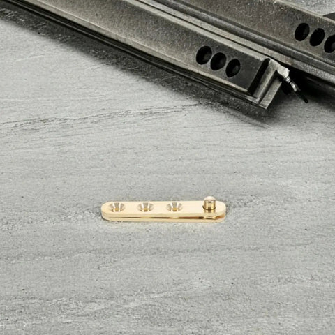 Hidden Pivot Door Hinges With Sleek Gold Finish, 8 Piece Copper Set on gray surface, close-up of hinge component