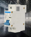 Front view of 230V 80A 100A 125A Air Circuit Breaker DZ47-125 1P Miniature Circuit Breaker in a workshop setting.