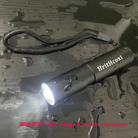 Rechargeable Mini LED Flashlights Set Of 6 High Brightness 1200 Lumens XPE With 3 Modes Zoomable Waterproof Aluminum Body on wet surface