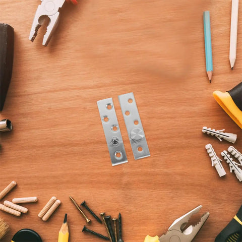 Two Pairs Stainless Steel Pivot Hinges, 360 Degree Rotatable Concealed Door Hinges on a wooden surface with tools