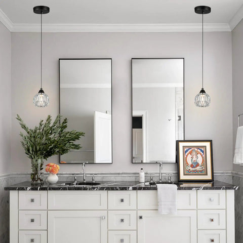 Bathroom with Three Light Matte Black Pendant Lighting With Transparent Glass Shades above mirror and sink