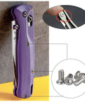 Hella Tough 304 Stainless Steel Pocket Knife Handle Screws And Shaft Pivot Pin Rivets 100 Piece EDC Folding Hardware Kit shown with a purple knife and assorted screws.