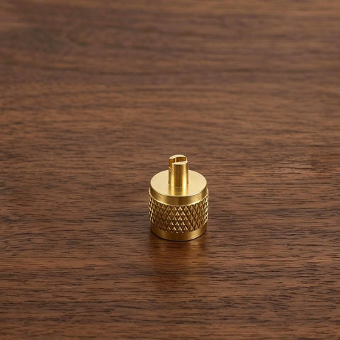 Professional Grade Beefy Brass Refrigeration Valve Caps With Slick Knurled Nozzles For Ac Systems And Coolant Lines Leak Proof Field Service Covers No Sweat Maintenance 30 Pack brass valve cap on wooden surface.