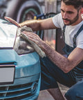 Mechanic using Recycled Multipurpose Industrial Wiping Cloths 49 Lb Pack Assorted Colors on car headlight for oil cleanup