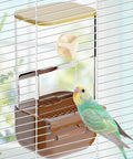 Slick Automatic Bird Feeder With Sturdy Perch And Transparent Seed Bin shown with a parakeet on a cage bar.