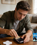 Man using Phone Screen Scratch Repair Kit With Metal Frame Fix For Quick Pro Grade Long Lasting Solution Portable Resin Abrasive Compound External Body Polish And Protector Cream For Cellphones And Gadgets on smartphone screen at home.