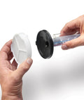 Hands holding the lid and filter of a Professional HEA Airless Paint Sprayer for easy assembly and maintenance.