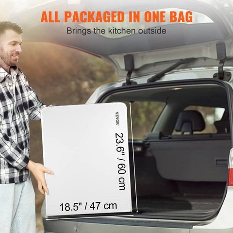 Man loading folded Camping Kitchen Station With Three Adjustable Heights into car trunk for outdoor use