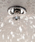 Sleek Recessed Fire Sprinkler Escutcheon Trim Ring Covers 1/2 Inch Ips Pipes with water spray, showing installation detail.